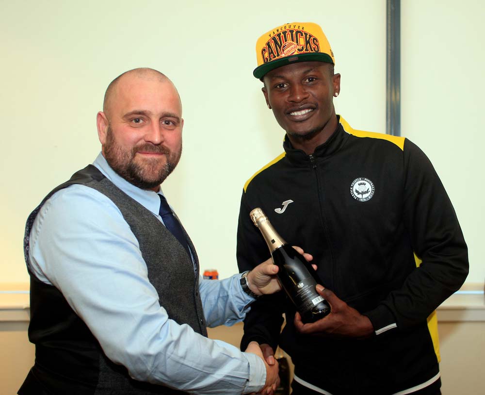Osman receives his man of the match award from match sponsors, Richmack.